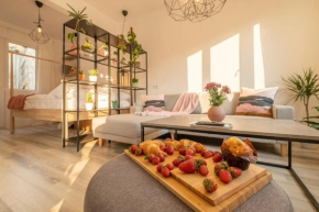 Whitish 2BDR Apartment with Queen Size Bed and Air Conditioning